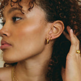 simple everyday waterproof gold hoop earrings with a sleek design.